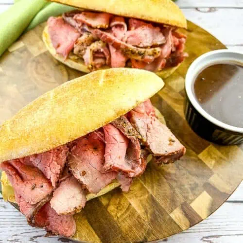 Smoked French Dip Sandwiches with jus on the side.