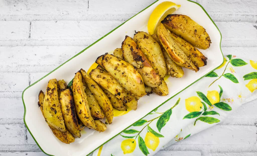 A top-down shot of Greek Lemon Potatoes on a platter.