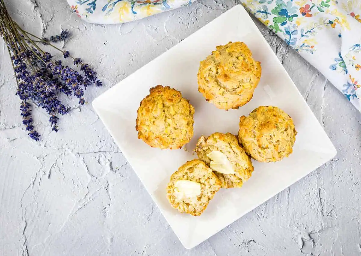 Finished muffins with a pat of butter on them.