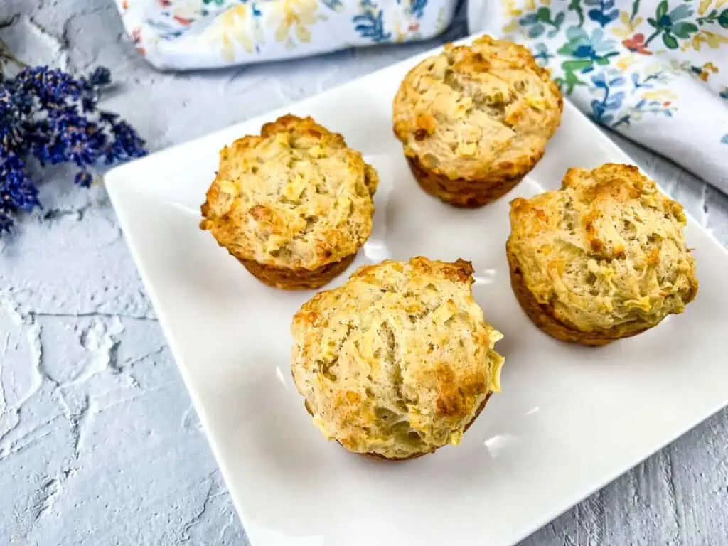 Apple Cheddar Muffins on a white plate.