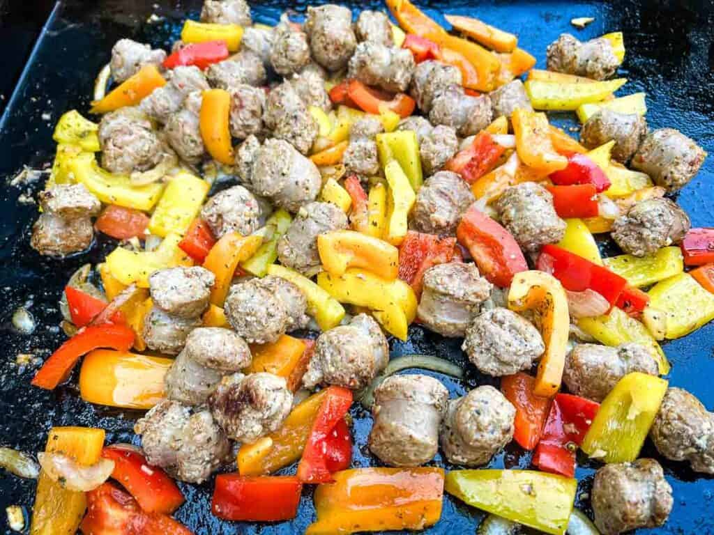 Sausage tossed with peppers and onions and seasoning.