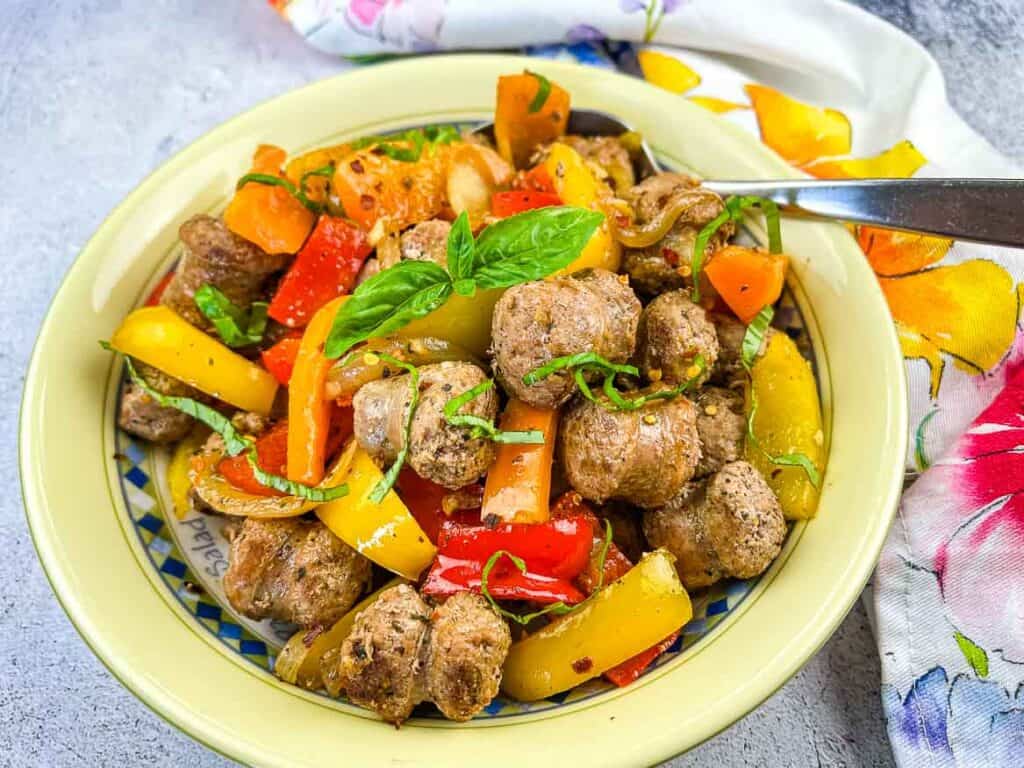 Finished Blackstone Sausage & Peppers in a serving bowl.