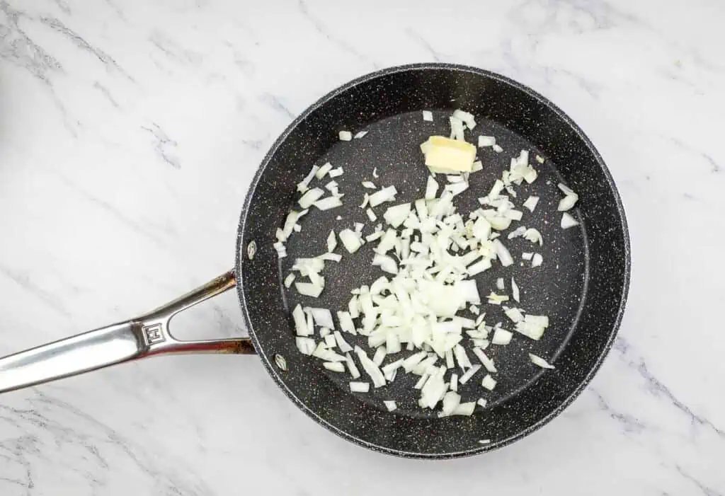 Sautéing onions in a skillet. 