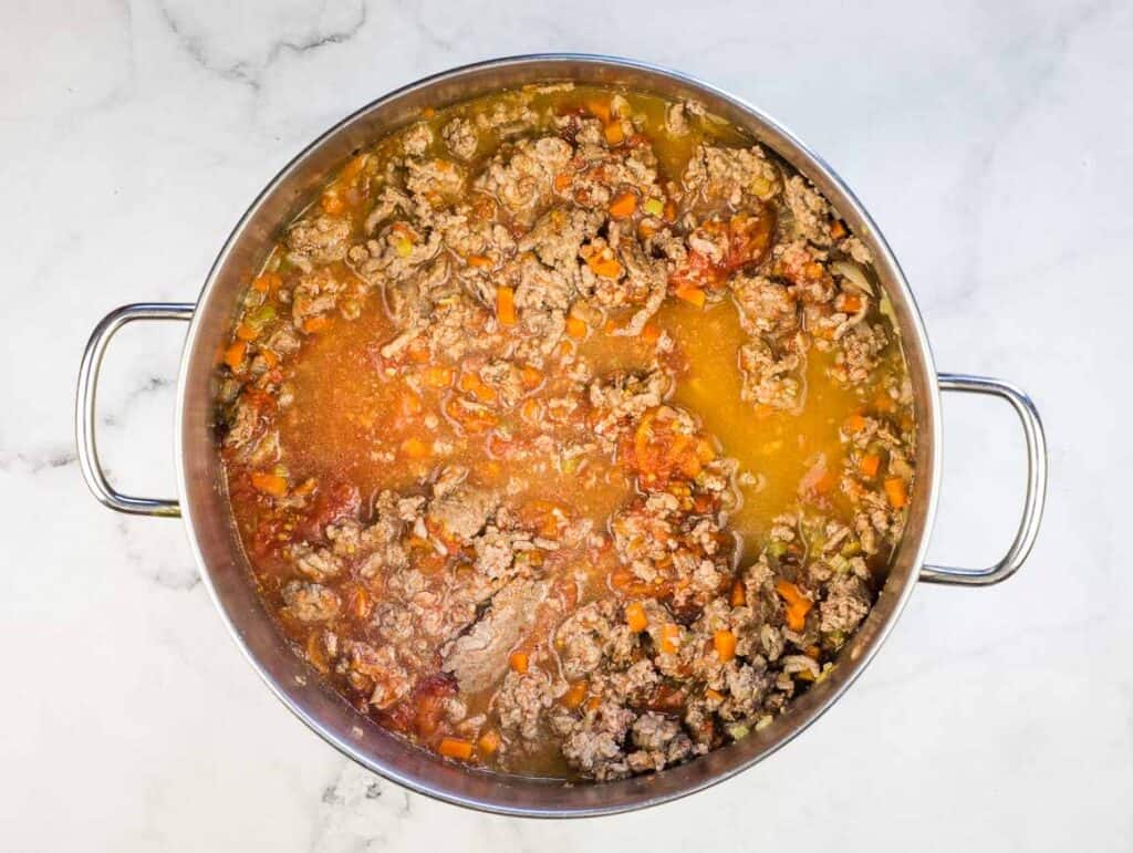 Broth added to the pot.