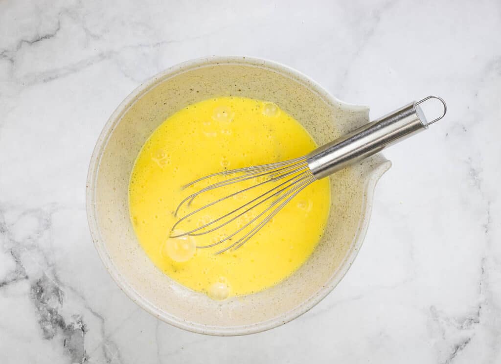 Whipped eggs in a bowl.