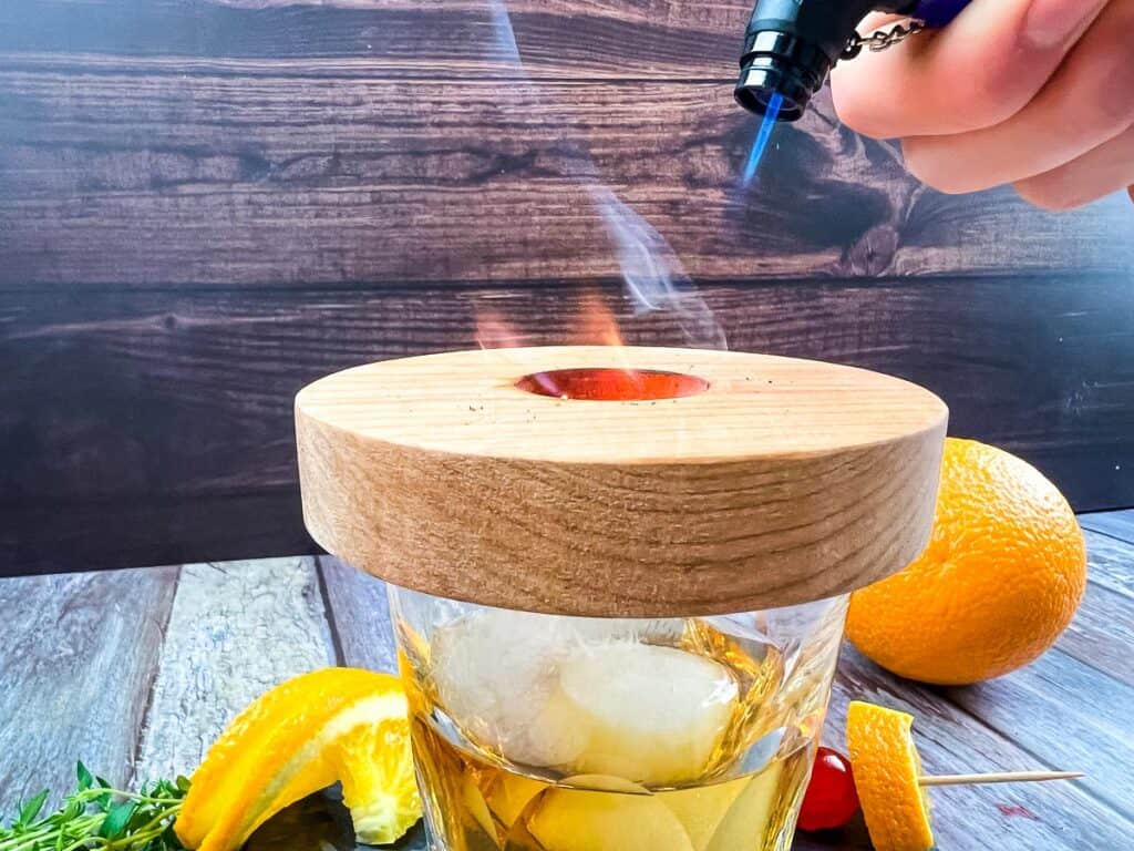Torch the shavings in the mesh basket.