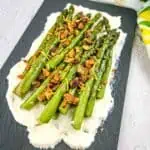 Oven Roasted Asparagus with Mascarpone on a black platter.