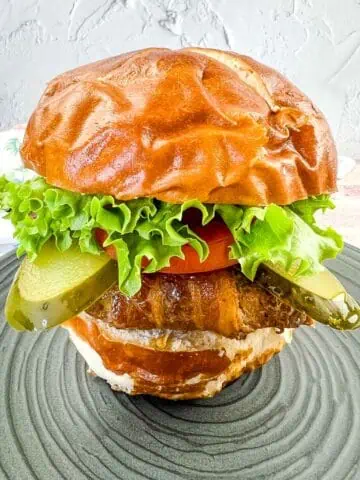 Bacon-Wrapped Burger on a pretzel bun.