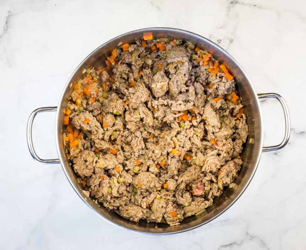 Cooked meat and vegetables in the pot.