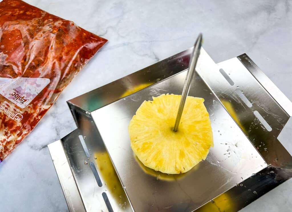 Pineapple on the bottom of the vertical skewer.