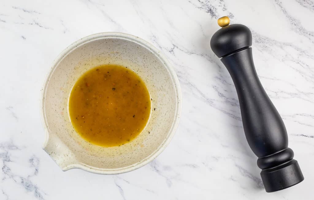 Emulsified oil and vinegar in a bowl.
