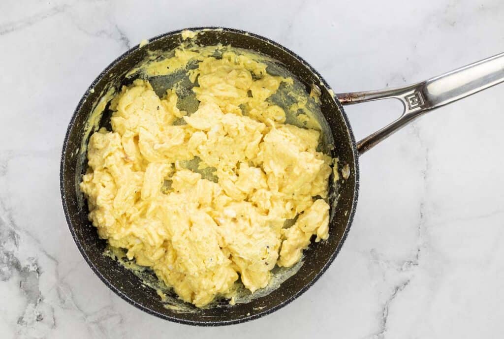 Scrambled eggs in a skillet.