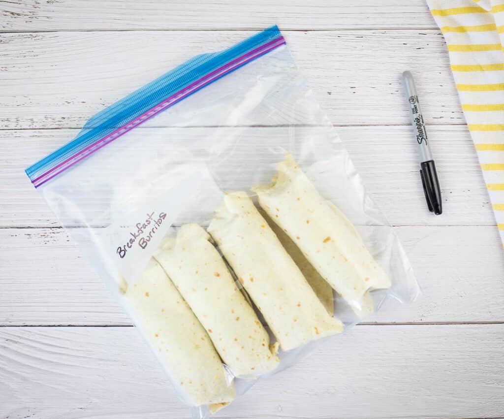 Frozen burritos in a zipper top bag.