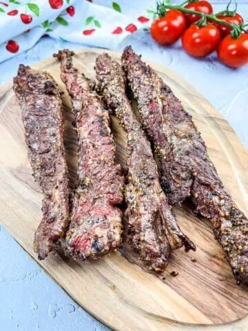 Grilled Beef Finger Meat on a cutting board.