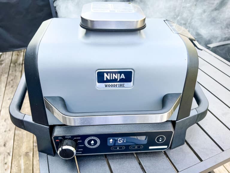 An image of a closed Ninja Woodfire Grill with smoke setting on.