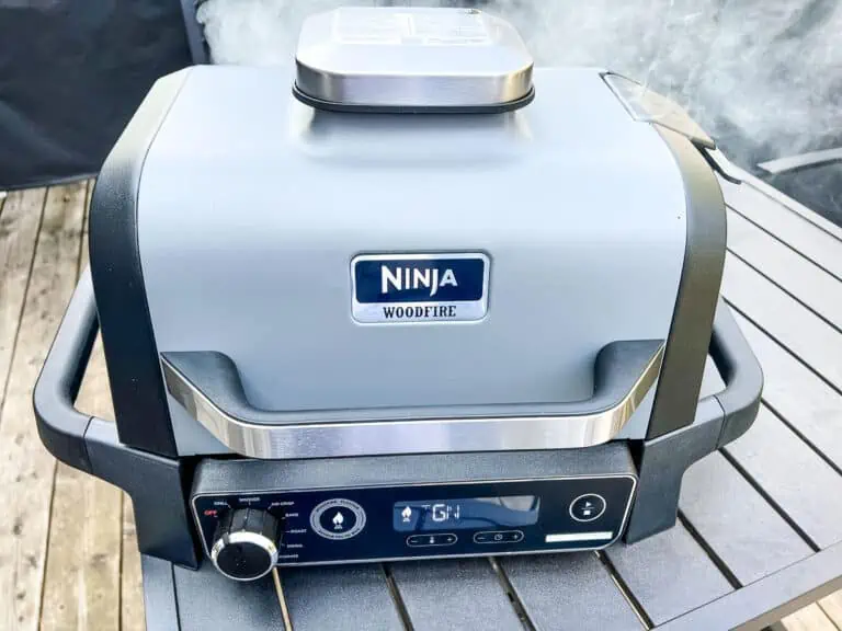 An image of a closed Ninja Woodfire Grill with smoke setting on.