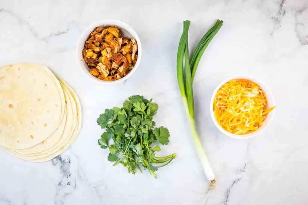 Ingredients to make Al Pastor Chicken Quesadillas.