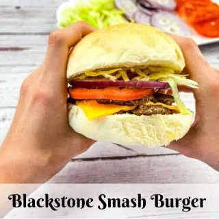 Blackstone Smash Burger held in two hands.