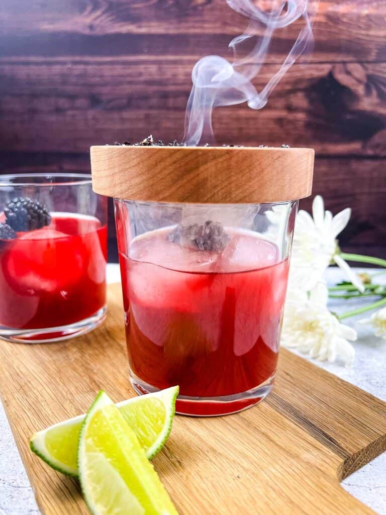 Finished Smoked Blackberry Margarita with the plate on top.