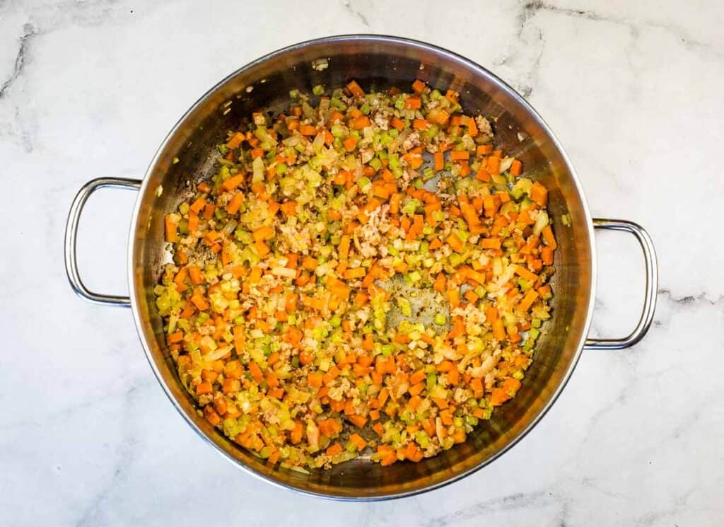 Sweating the vegetables in a large pot.