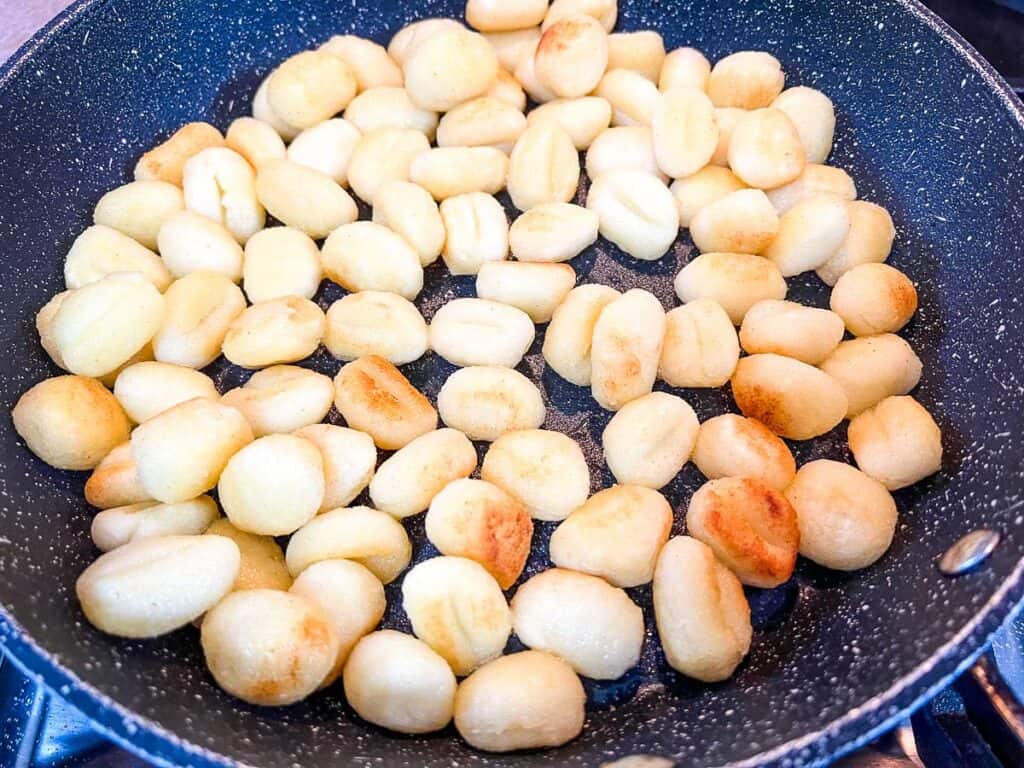 Browning the gnocchi in a skillet.