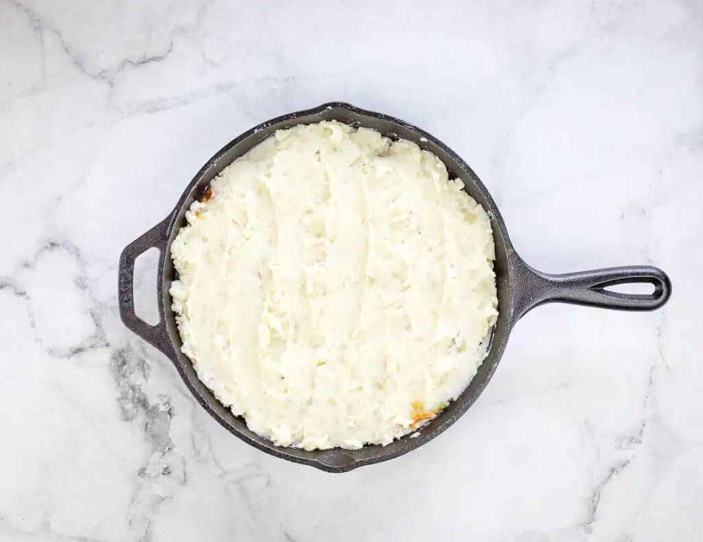 Leftover Roast Beef Shepherd's Pie topped with mashed potatoes.