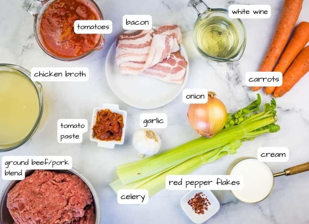 Labeled ingredients to make Bolognese sauce.