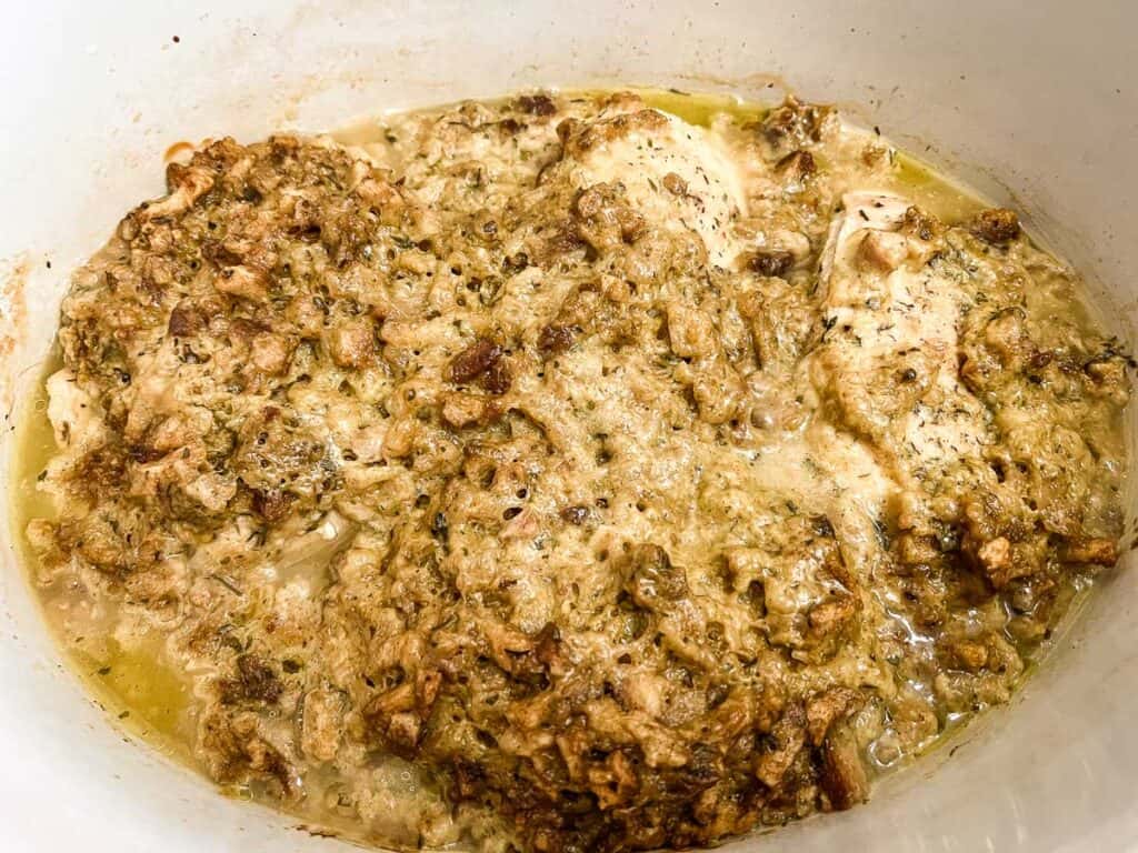 Cooked 4-ingredient slow cooker chicken in the slow cooker.