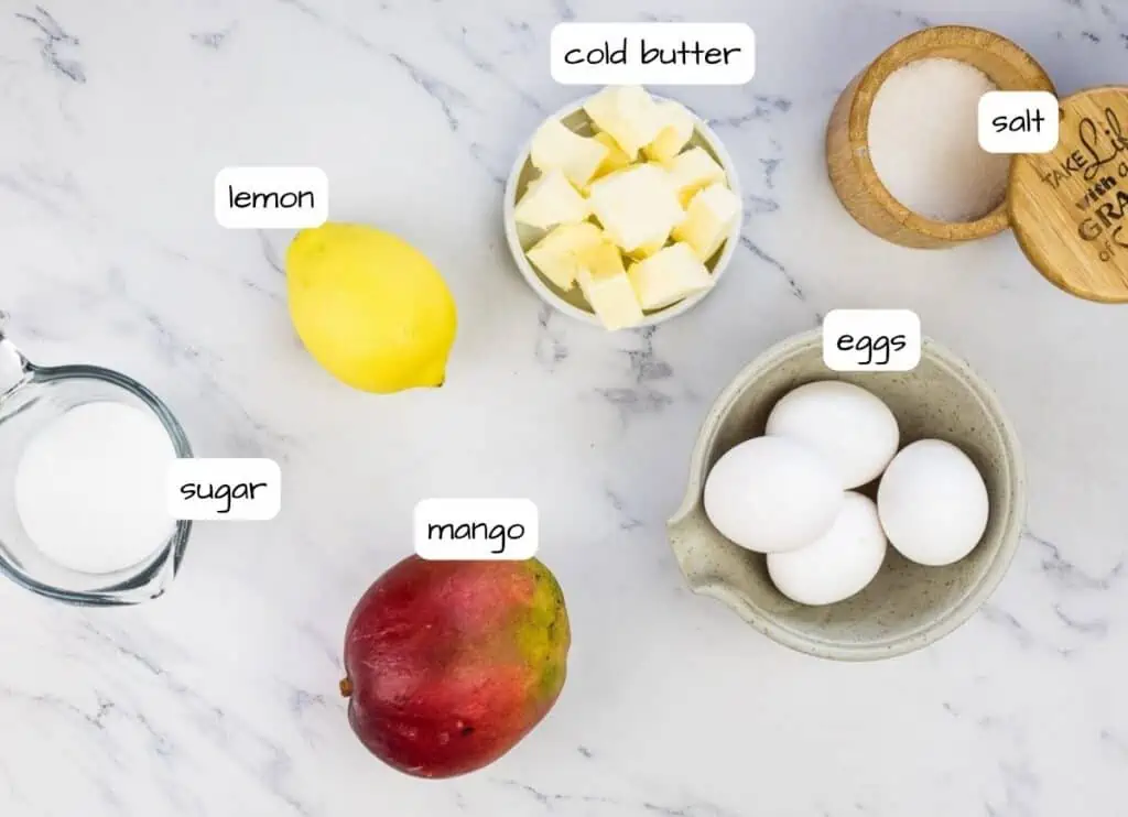 Labeled ingredients to make mango curd.