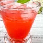 Strawberry-Lillet Crush in a glass with mint.