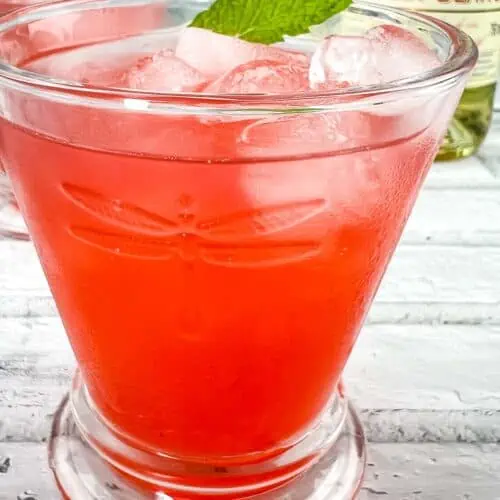 Strawberry-Lillet Crush in a glass with mint.
