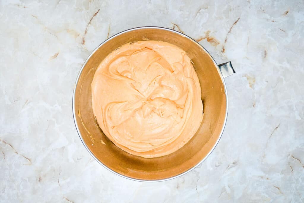 CAke batter tinted orange.