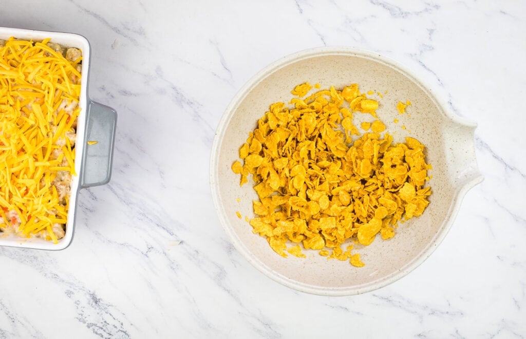 Buttered corn flakes in a bowl.