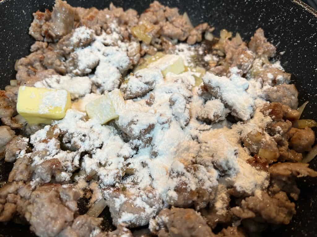 Flour added to the skillet with the meat and butter.