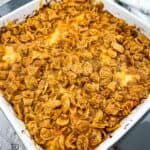 Cheesy Eggless Breakfast Casserole with Sausage in a white casserole dish.