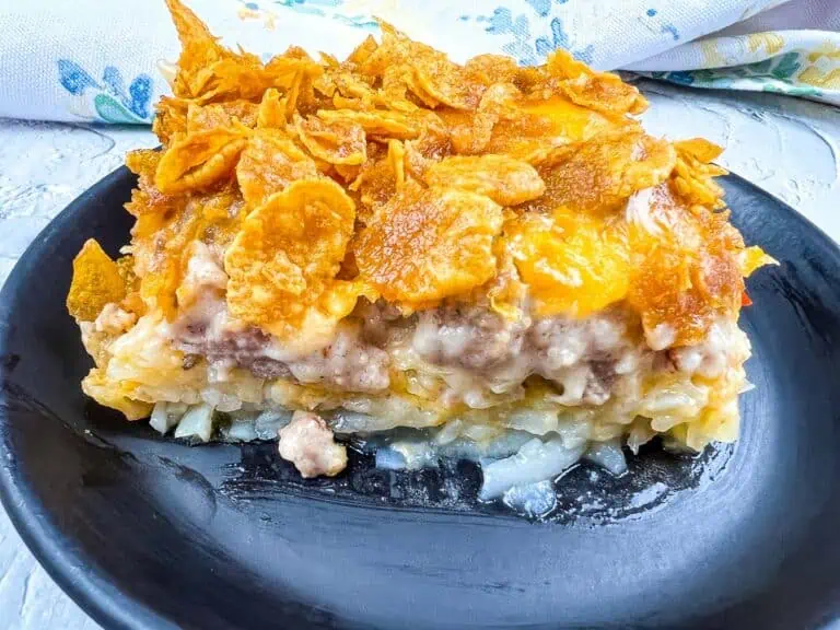 A plate of breakfast casserole on a black plate.