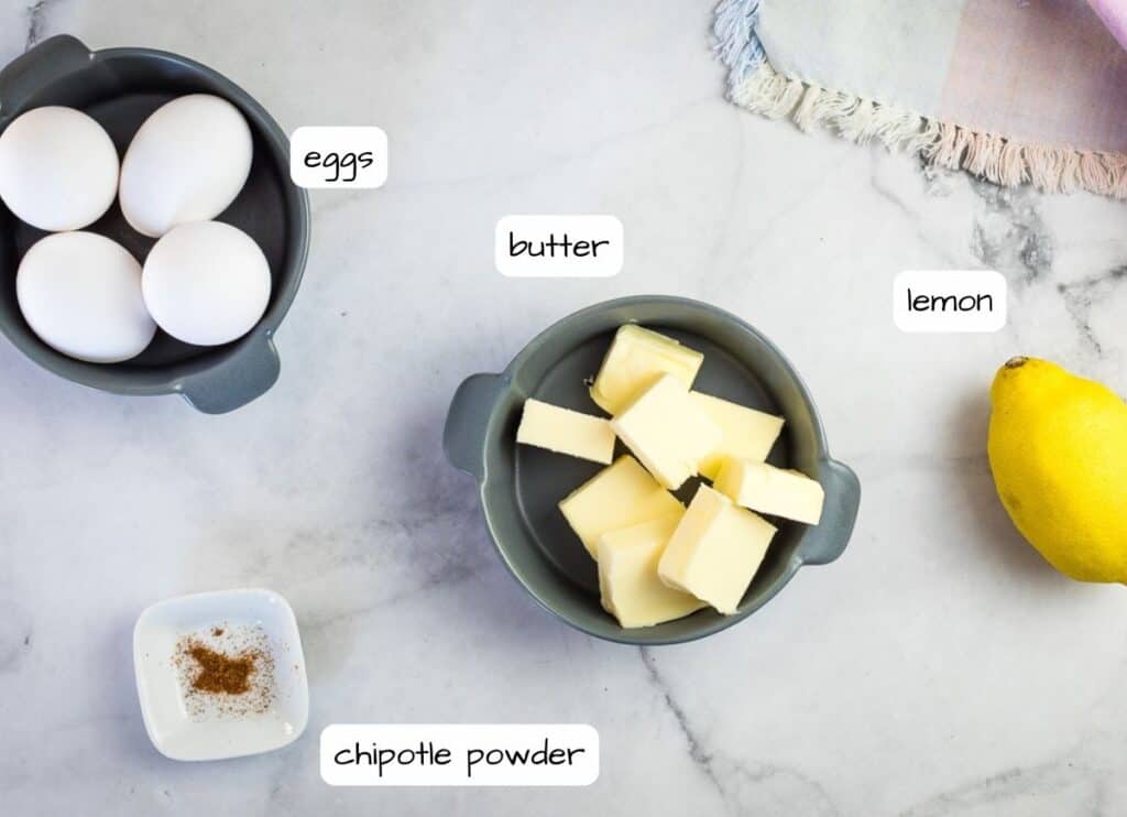 The ingredients for a chipotle hollandaise sauce on a counter.
