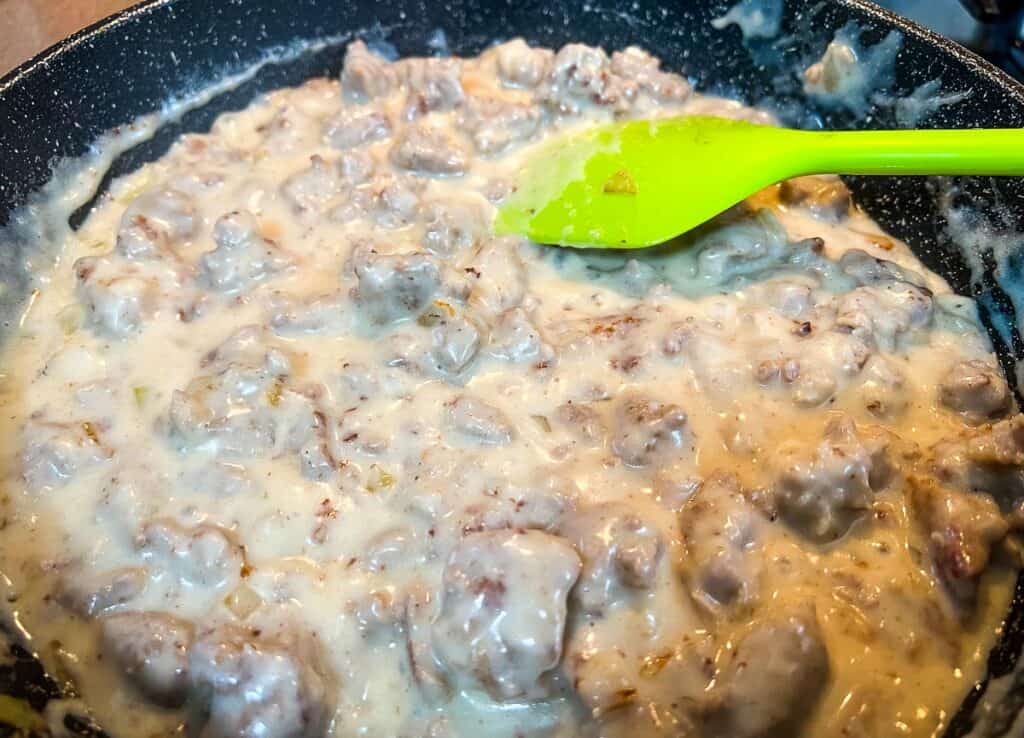 Thickened sausage gravy in the skillet.