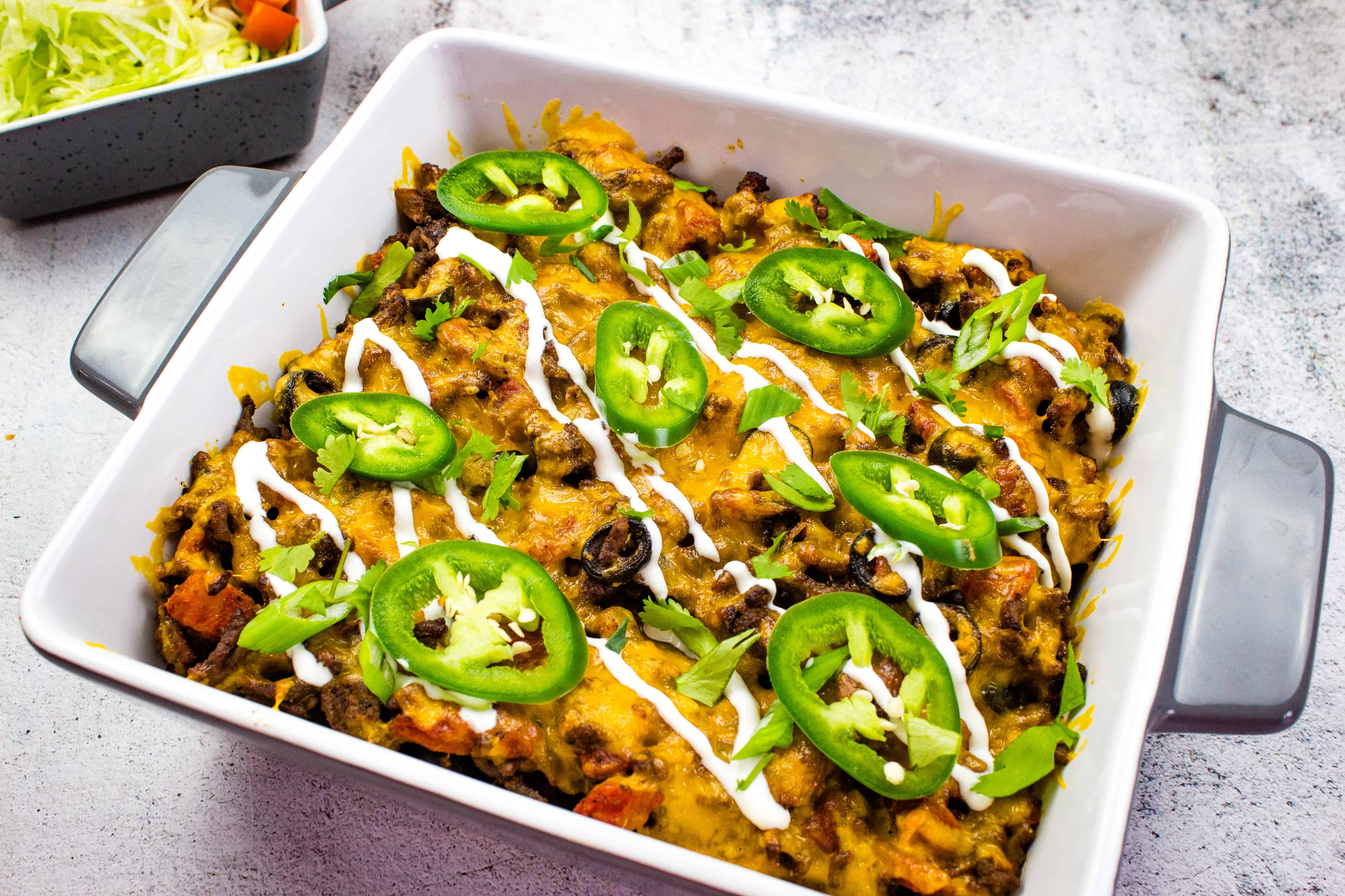 A Taco Casserole dish with black beans, cheese and jalapenos.