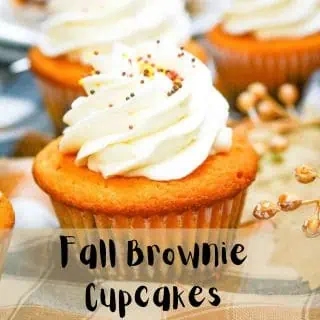 Fall brownie cupcakes with whipped cream and icing.