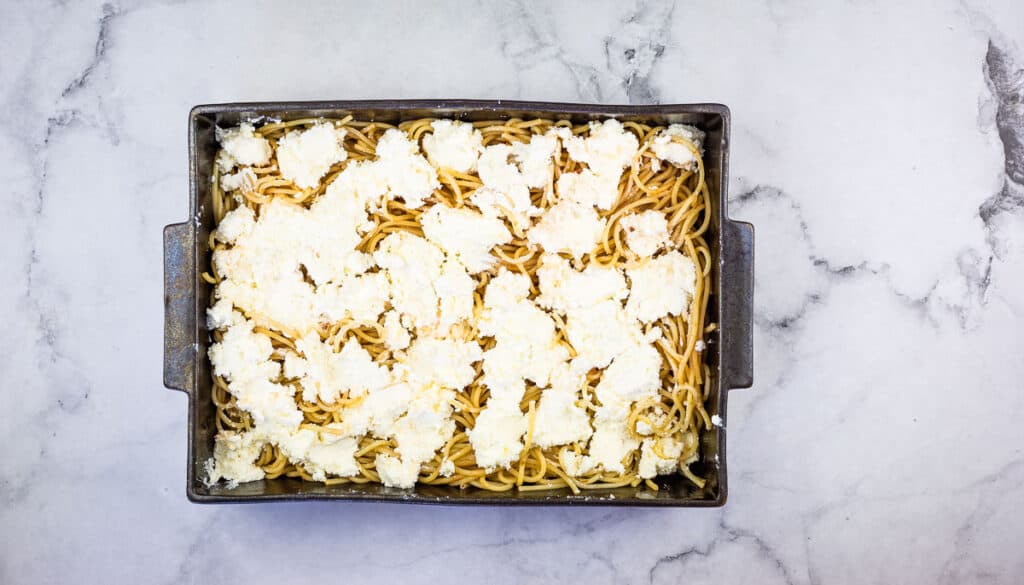 A baking dish filled with pasta and cheese.