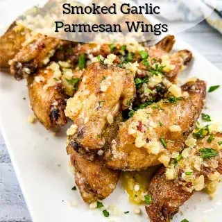 Smoked garlic parmesan wings on a white plate.