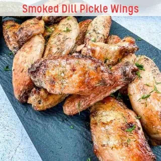 Smoked dill pickle wings on a plate.