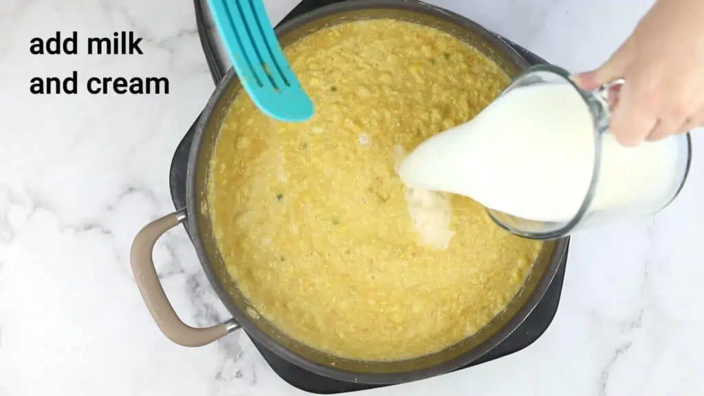 A person pouring milk and cream into a pan.