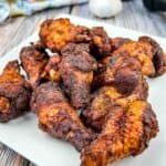 Smoked Dry Rubbed Chicken Wings on a white plate.