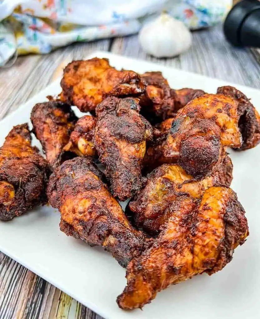 Smoked Dry Rubbed Chicken Wings on a white plate.