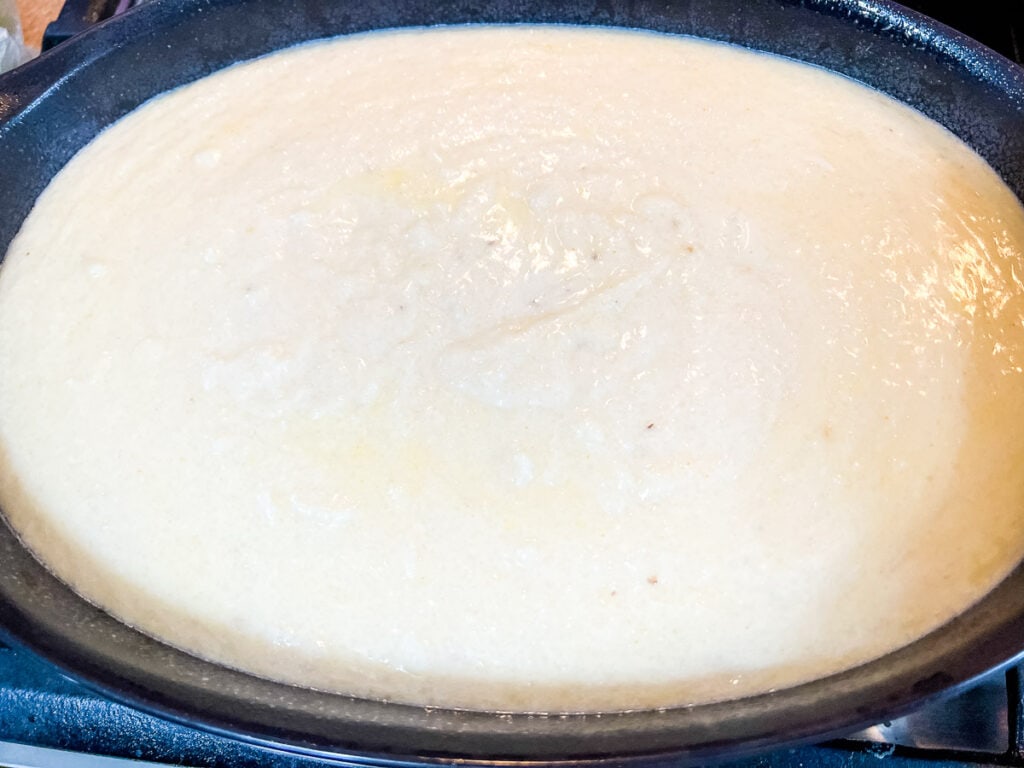 Grits in the casserole ready for the oven.
