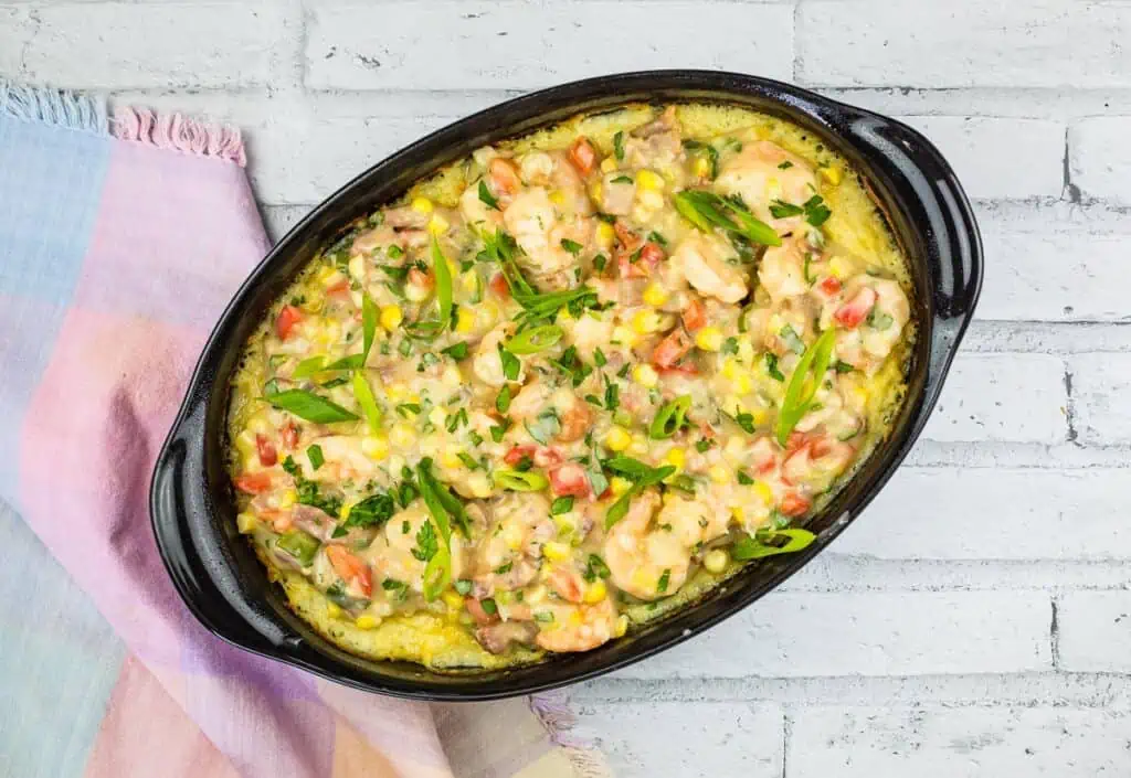 A casserole dish with shrimp and grits.