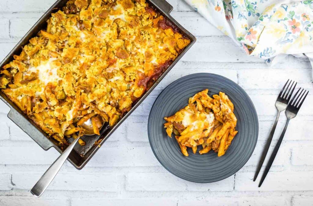 A sloppy joe casserole dish with a fork next to it.