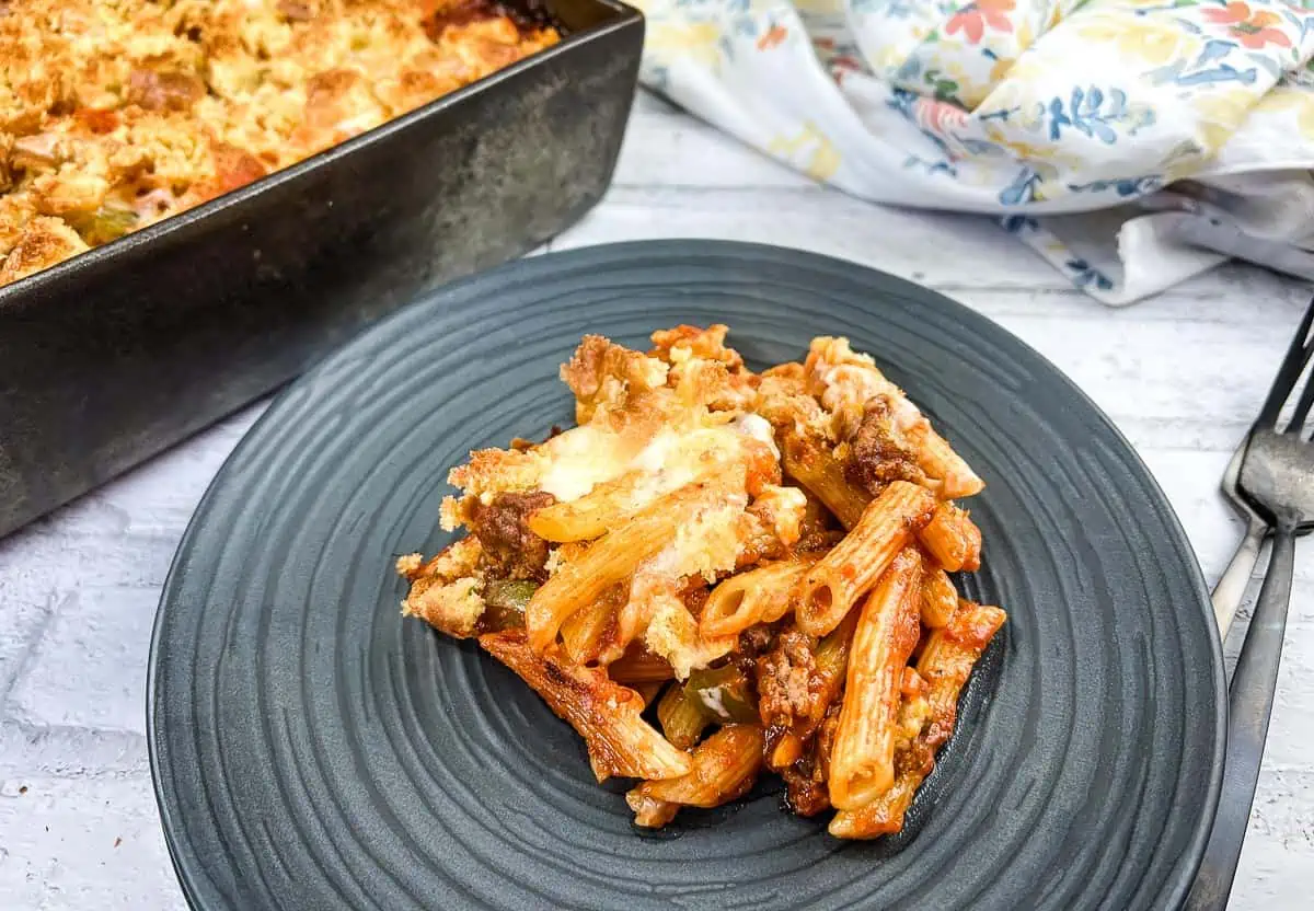 A serving of Sloppy Joe Casserole pasta with meat on a plate with a fork.